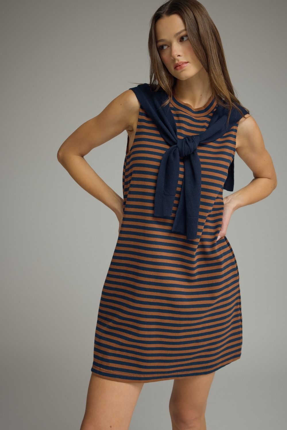 Ruby striped sweater overlay dress by ENTRO, casual 120 dress with a stylish layered sweater design and vibrant red and white stripes.
