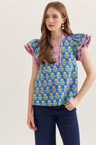 Entro floral top with flutter sleeves, stylish dressy blouse featuring a vibrant floral pattern and elegant design.