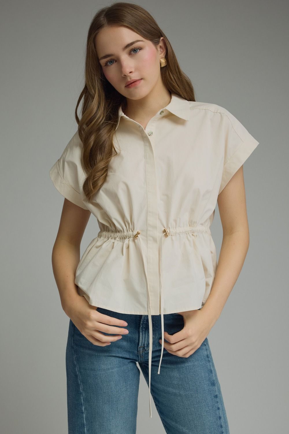 Ecru cap sleeve drawstring top by ENTRO, casual style with relaxed fit, shown on model with front view.
