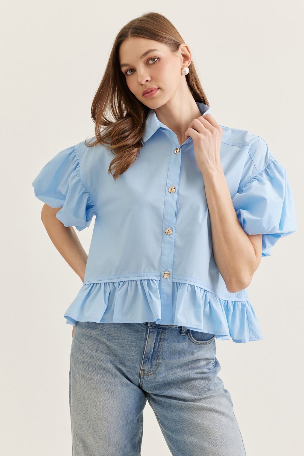 Light blue Maggie ruffle hem casual top by ENTRO, featuring a feminine design and soft fabric, perfect for everyday wear.
