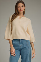 ENTRO Stacey solid half sleeve split neck top, a stylish fall sweater with a relaxed fit and classic design.
